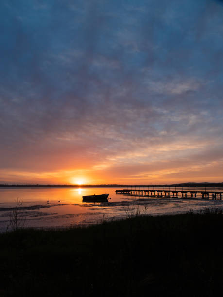 istock Boat and jetty sunrise 1293019781