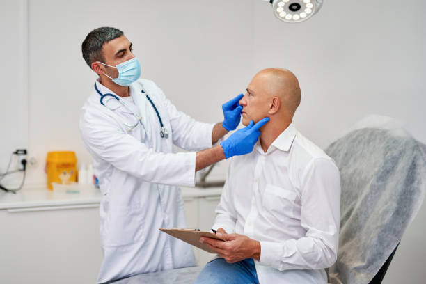 man meeting with plastic surgeon before operation in clinic. - nose job imagens e fotografias de stock