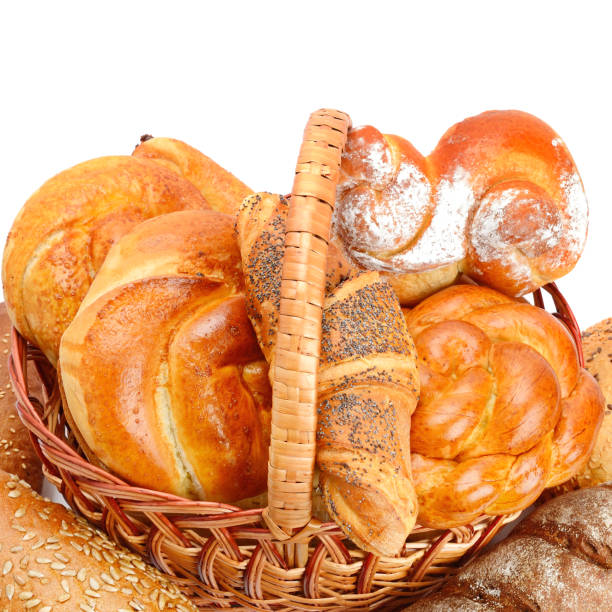 istock Various sweet pastries in a basket isolated on white background. 1293022772