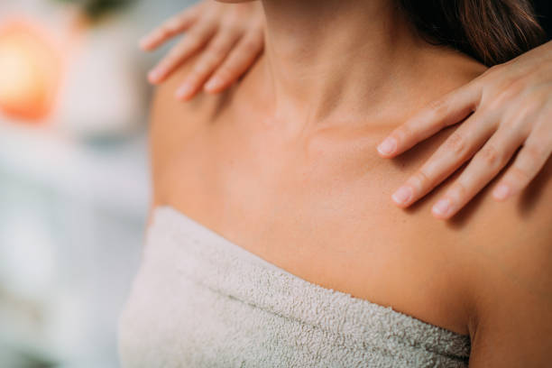 istock Ayurveda Massage Treatment. Massaging Shoulders with Ayurvedic Essential Oils 1293024363