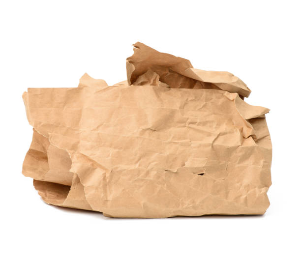 istock piece of crumpled brown paper isolated on white background, element for designer 1293024739