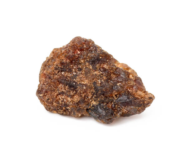 istock lump of brown cane sugar isolated on white background 1293025344