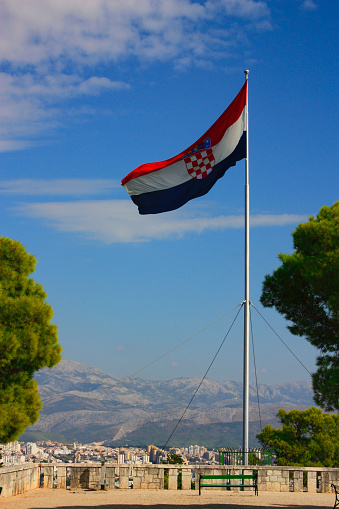 the national flag of croatia on the top of the marijan in split