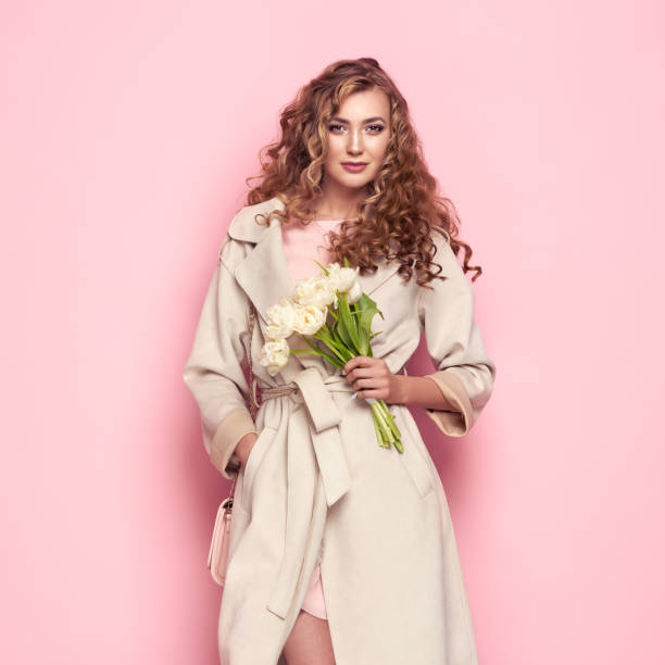 Young woman in white spring coat