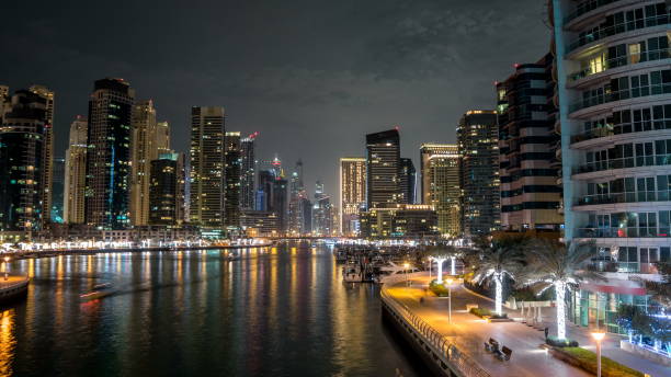 istock Promenade in Dubai Marina timelapse hyperlapse at night, UAE 1293029813