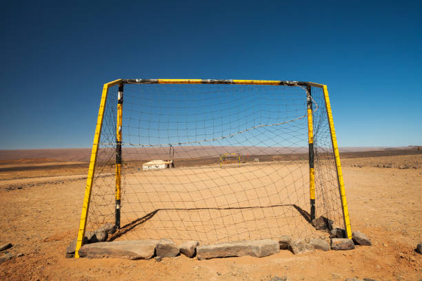 istock Soccer Field In The Sahara Desert 1293030290