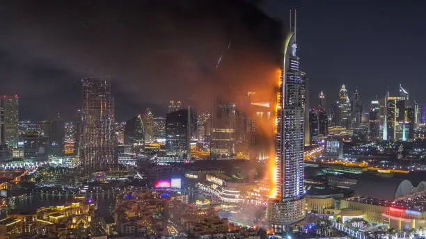 Huge Fire accident occured from the The Address Hotel near Dubai Burj Khalifa before New Year 2016 fireworks celebration timelapse on January 1,2016 at Dubai, UAE. View from top