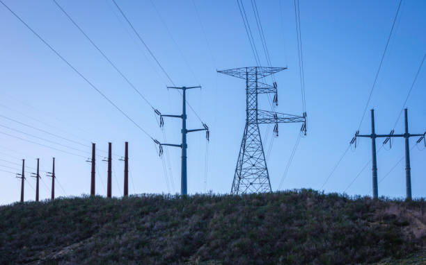 istock Multiple High voltage electricity pylons on the hill 1293034182