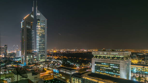istock Dubai skyline from top with Emirates Towers timelapse at night time. Dubai, UAE 1293035205