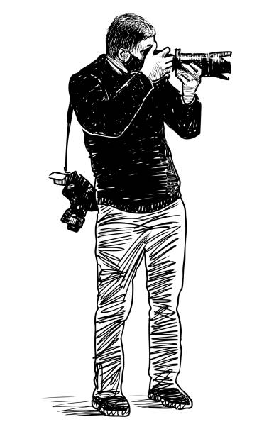 istock Sketch of young professional photographer at work 1293035256