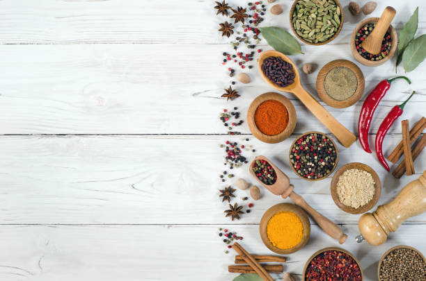 istock Spices and herbs on white wooden table 1293036485
