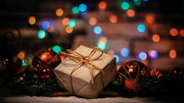istock Christmas present on the background of Christmas lights 1293037635