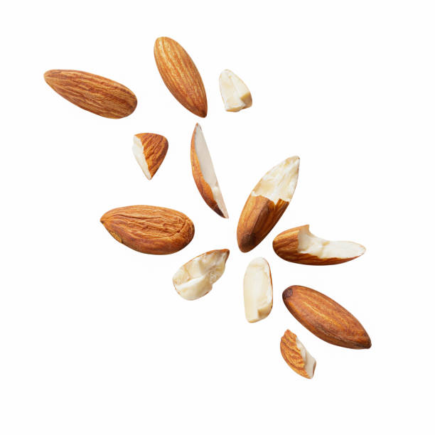 istock almond piece fly explosion on white isotated .Clipping path 1293038628