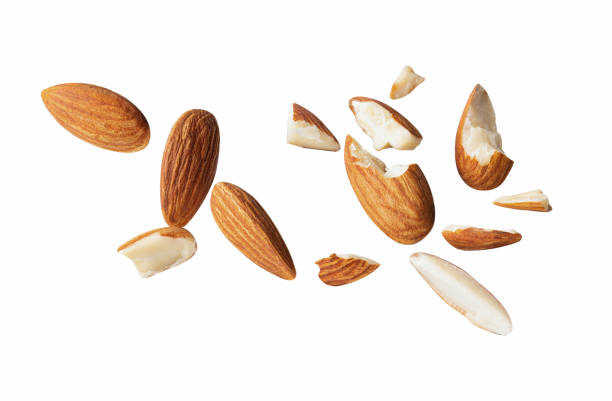 istock almond piece fly explosion on white isotated 1293038630