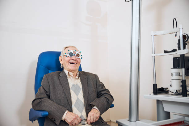 istock Pleased pensioner smiling during the visual acuity test 1293039017