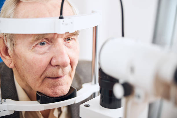 istock Aged male patient having his eyes examined 1293039039
