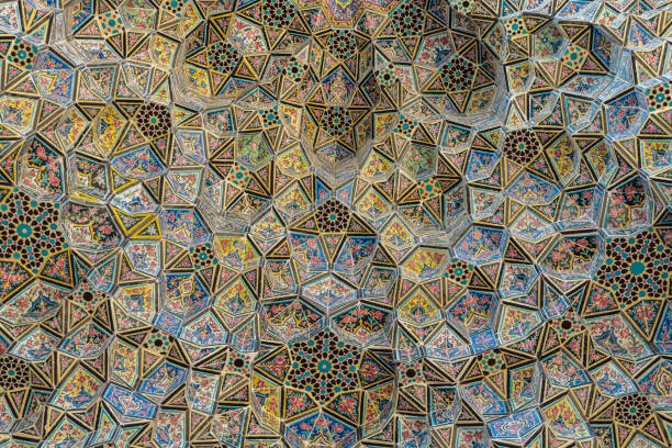 Colorful and rosy mosaic  patterns on the ceiling of Nasir Al-Mulk Mosque (Pink Mosque) in Shiraz, Iran stock photo