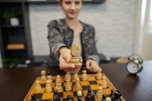istock Woman playing game of chess 1293040577