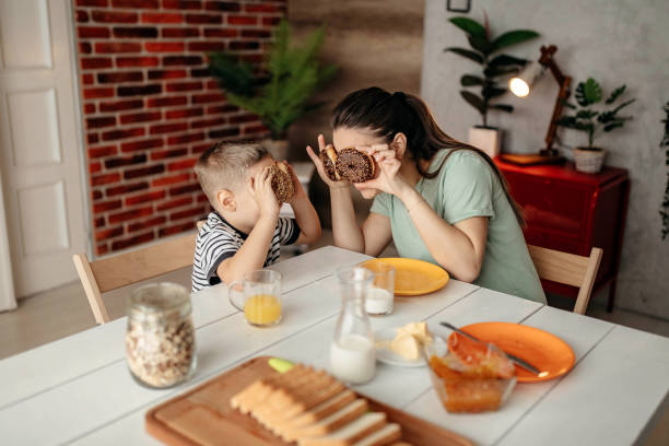 istock Mom and son enjoy breakfast together 1293041210