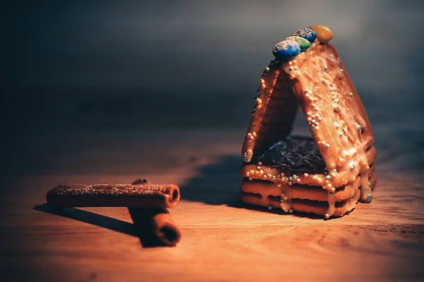 Christmas table. candle , oranges and cinnamon sticks on wooden