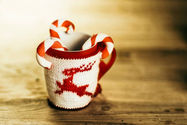 istock Christmas mug and candle on wooden background 1293041240