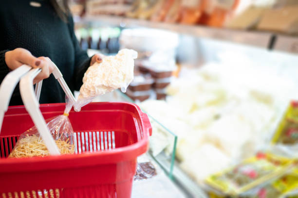 istock Young woman buys dairy products 1293041530