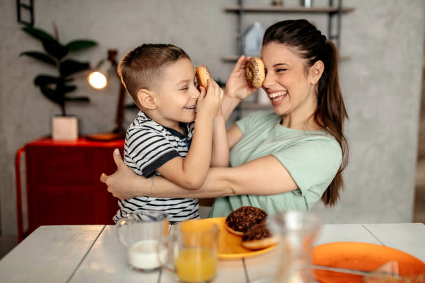 istock Mom and son enjoy breakfast together 1293041830