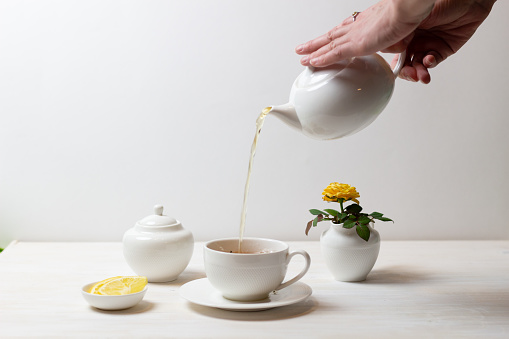 tea time drinking in white and yellow colors