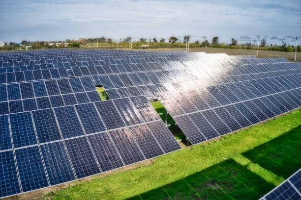 istock Fly over a renewable solar power plant with sun in Ukraine 1293043758
