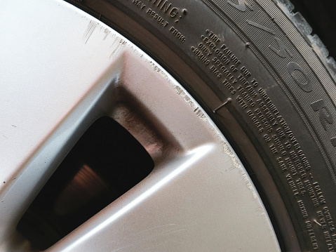 Scratches on the gray alloy wheels of the car