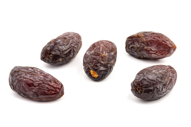 istock Dried dates fruits isolated on white background 1293047459