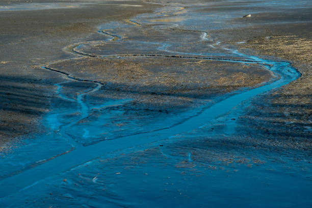istock Bend of the stream on a flat plane 1293049632