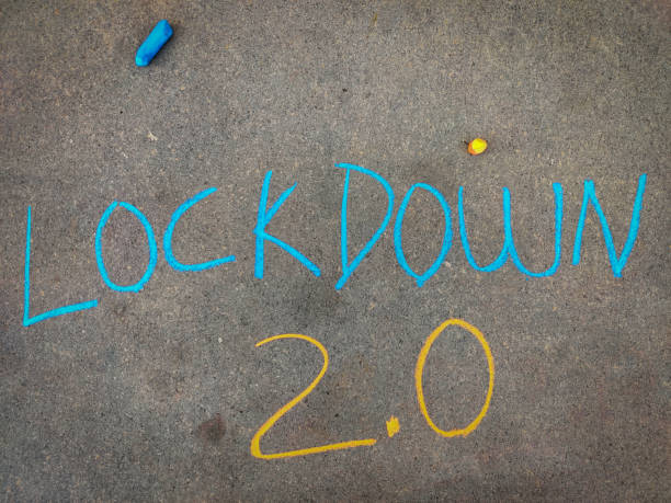 istock The inscription text on the grey board, Lockdown 2.0 Using color chalk pieces. 1293053236