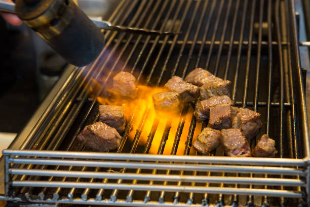 istock Delicious fire-roasted beef at the party. 1293053282