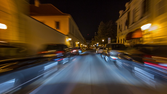 Drive at fast speed at the night streets in downtown timelapse hyperlapse drivelapse. Blured road with lights on high speed. Prague, Czech