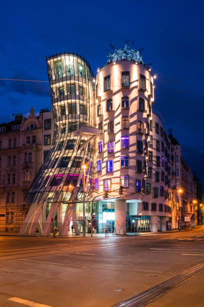Dancing House at Night, Called Tancici Dum in Czech in Prague Prague, Czech Republic - July 10 2020: Dancing House Illuminated at Night. Nicknamed Fred and Ginger, Called Tancici Dum in Czech in Prague, designed by Vlado Milunic and Frank Gehry. frank gehry building stock pictures, royalty-free photos & images