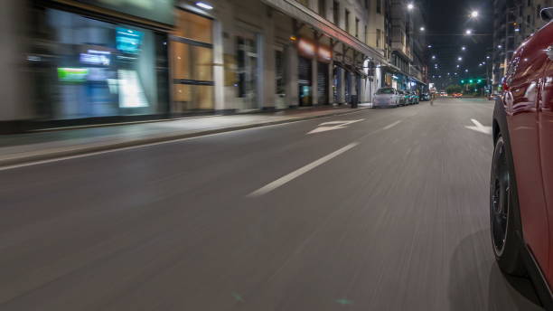 istock Car moves at fast speed at the night avenue timelapse hyperlapse drivelapse 1293054431