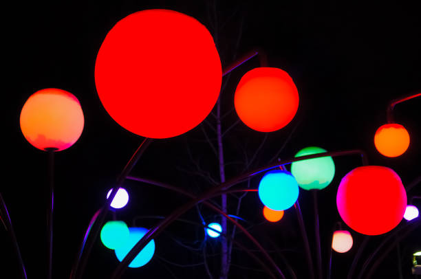 istock Colorful round lights on a dark background 1293055435