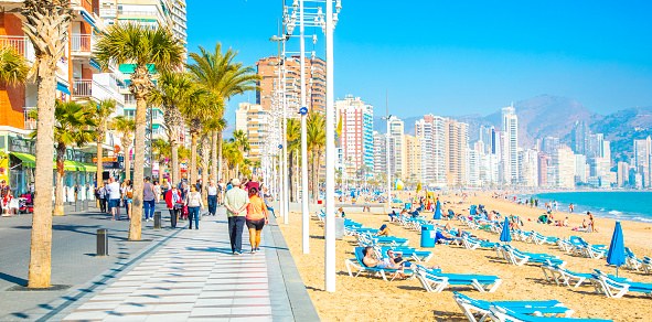 Benidorm, Spain - 14 March 2020: Panoramic view of Levante city beach and seafront walkway. Benidorm is popular touristic resort in Costa Blanca region on the Mediterranean sea.