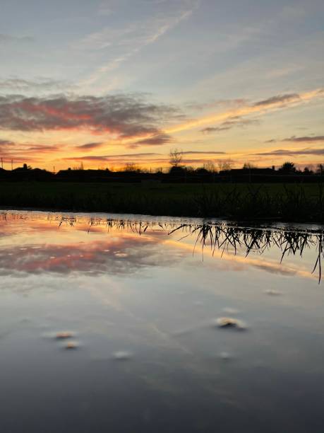 istock Sunset over water Rumburgh Suffolk 1293065578