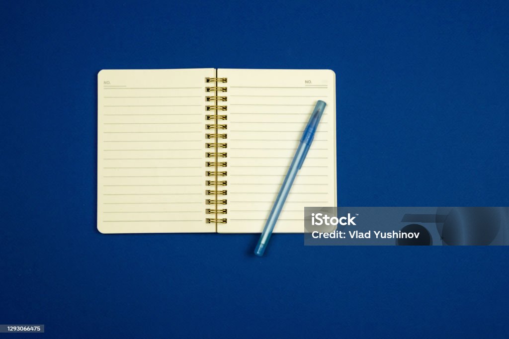 Notepad For Notes And Pen On A Simple Blue Background Flat Design Top ...