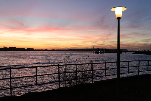 Street lamp at dusk on the banks of the Elbe