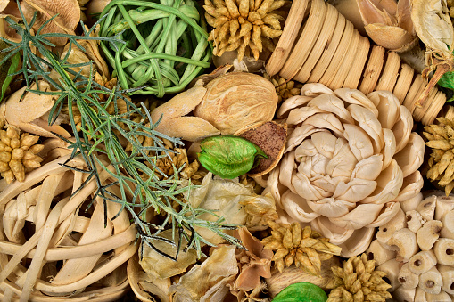 Top view of potpourri with twig balls and Pinecones, potpourri texture background, macro of potpuri