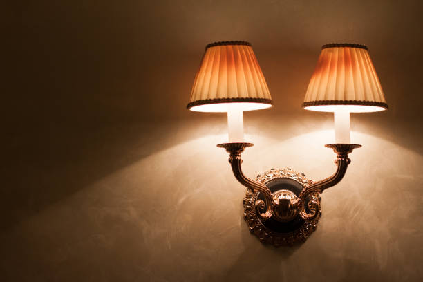 istock Vintage wall lamp on old textured wall 1293068284