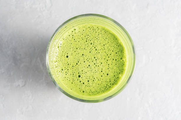 istock A glass of matcha tea on a concrete background. Top view. 1293068921