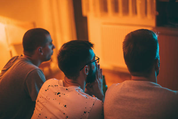 istock Cheerful male friends playing video games 1293070093