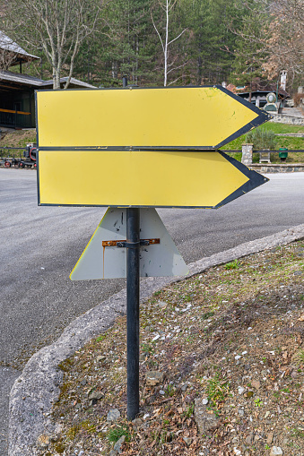 Two Directional Arrows at Traffic Sign Pole