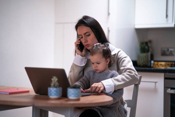 istock Young mother working at home with her daughter 1293076043