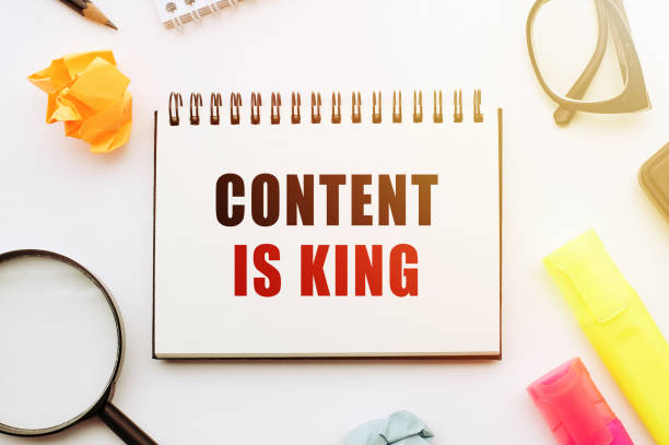 istock text CONTENT IS KING written on notepad with markers, pensil, magnifier and dollars. Business concept 1293076833