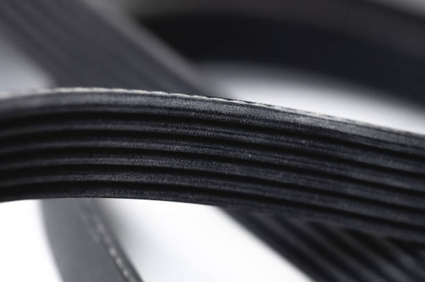 New rubber drive belt for internal combustion engine attachments. Alternator poly-V belt. Close-up stock photo
